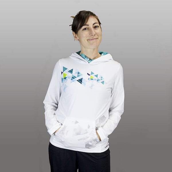 thumbnail woman wearing a white hoodie hands in pocket