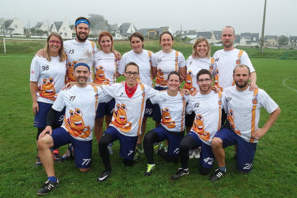 team wearing white and orange sublimated jerseys