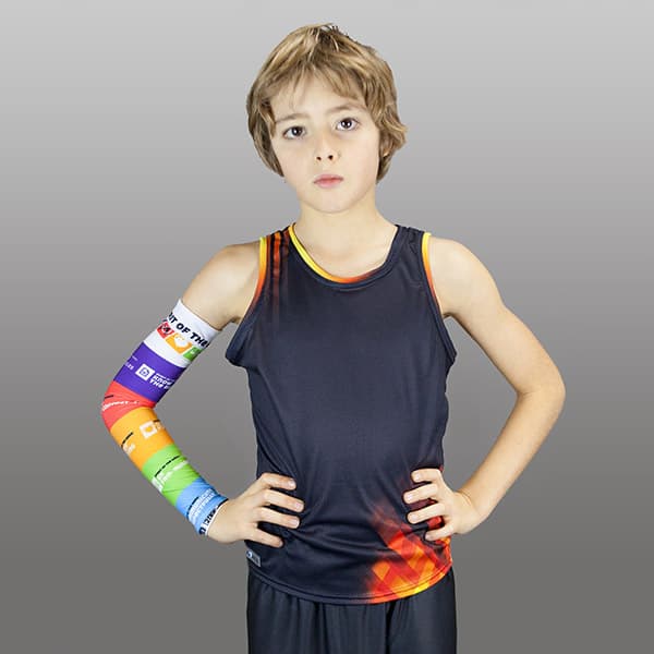 thumbnail woman wearing a rainbow couloured compresion sleeve and a dark grey t-shirt