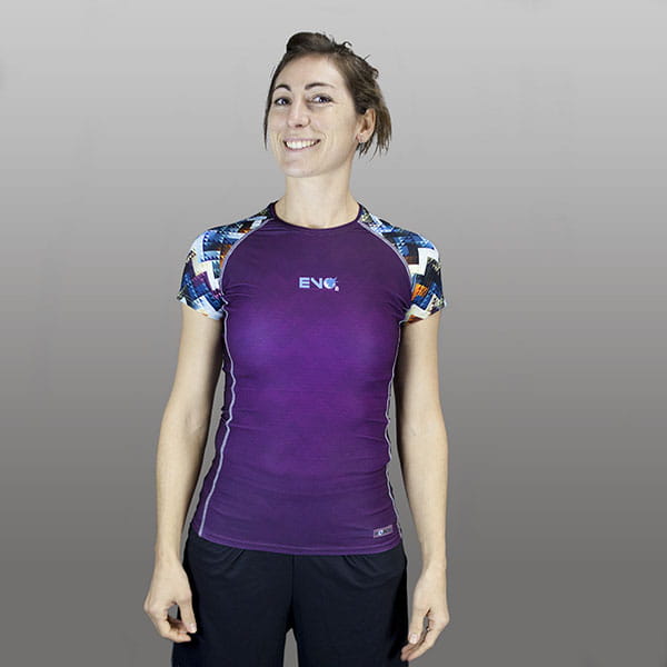 thumbnail woman smiling wearing a purple compression top