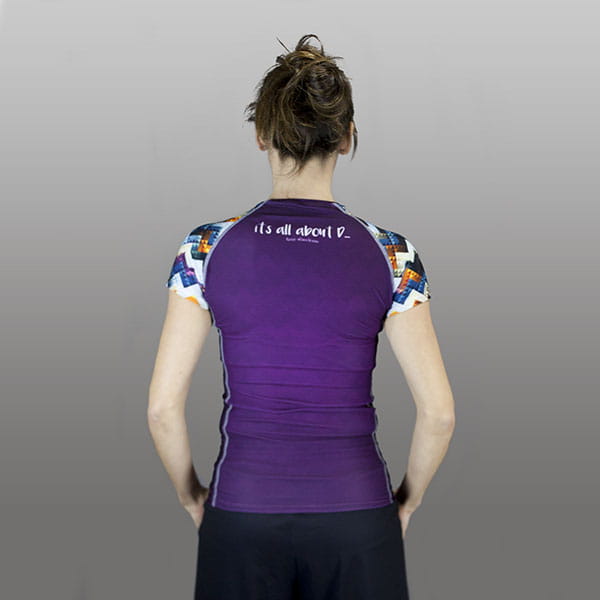 thumbnail back of woman wearing a purple compression top