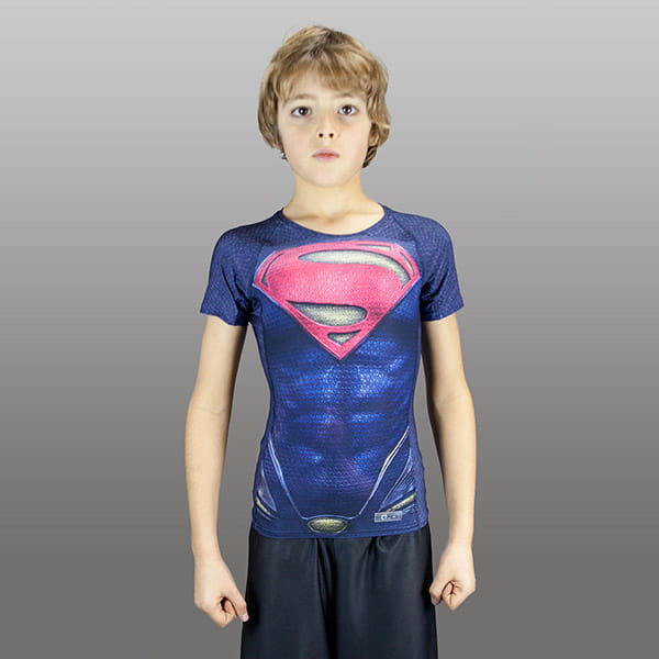 blond kid wearing a superman compression top