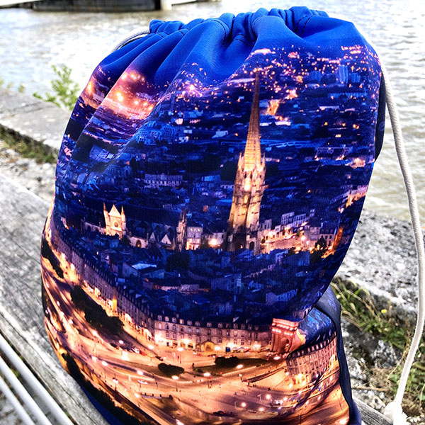 close-up view of sublimated drawstring bag showing bordeaux by night