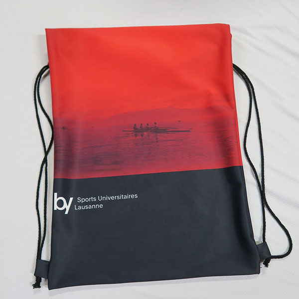 red and black drawstring bag flat lying