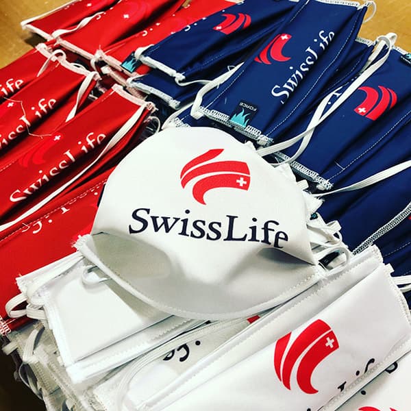 swisslife facemasks piling on a table