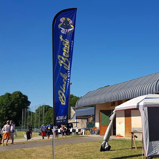 dark blue and yellow beach flag at sporting venue