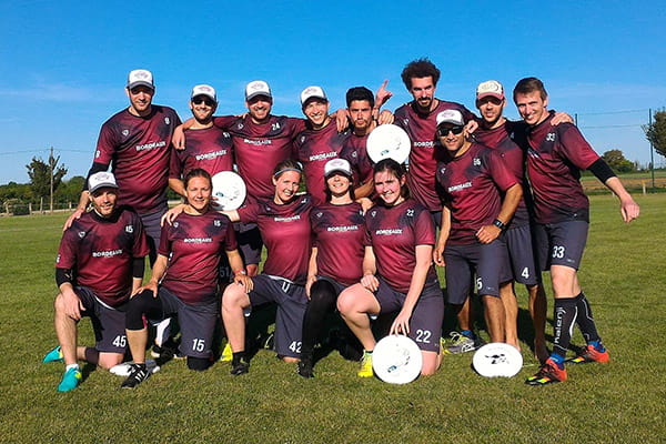 team 33tours posing in red sublimated jerseys