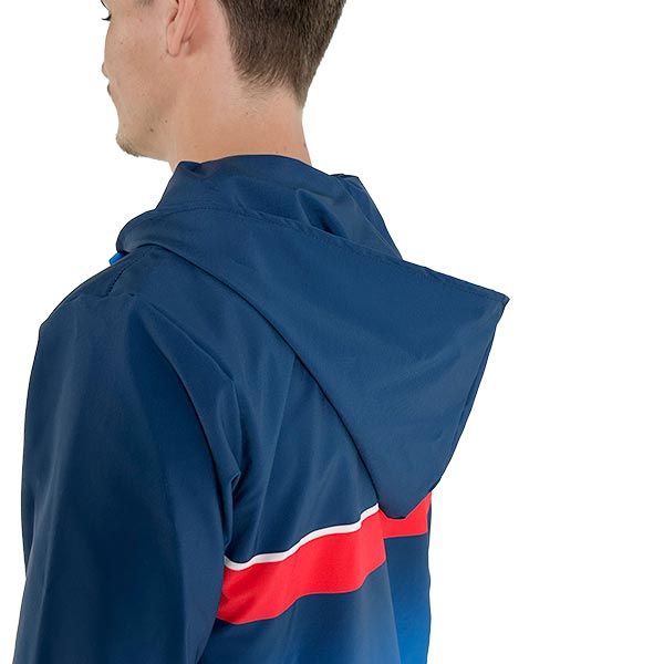 back of man wearing a sublimated blue jacket with a hoodie