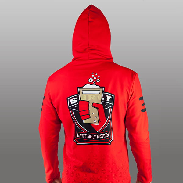 man wearing a red sublimated hoodie opening side zip
