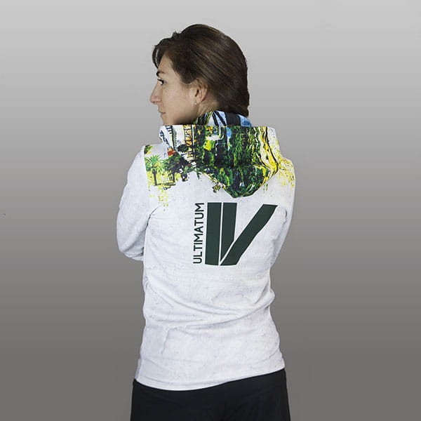 back of woman wearing a white sublimated hoodie with hood down