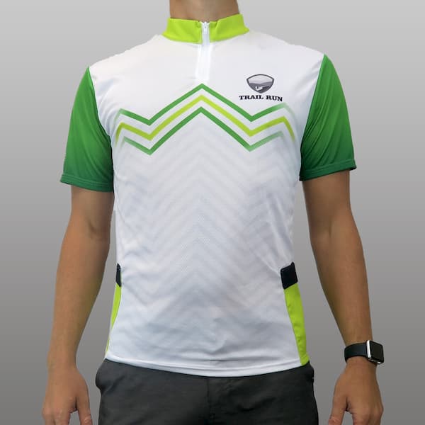 torso of man wearing a white and green trekking jersey