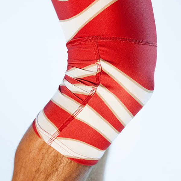knee with red reinforced tights
