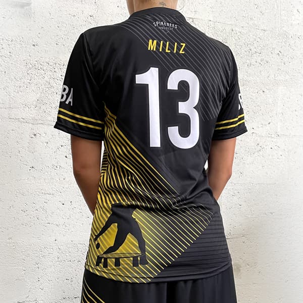 thumbnail back of woman wearing a black and yellow sublimated jersey #13