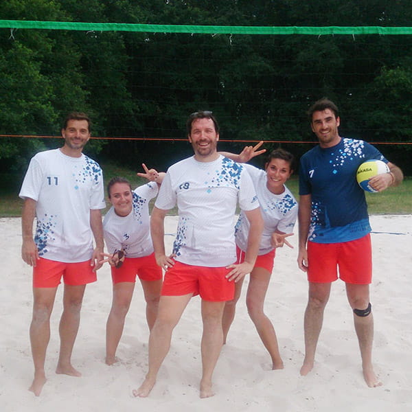 thumbnail volleyball players wearing white shirts and red shorts