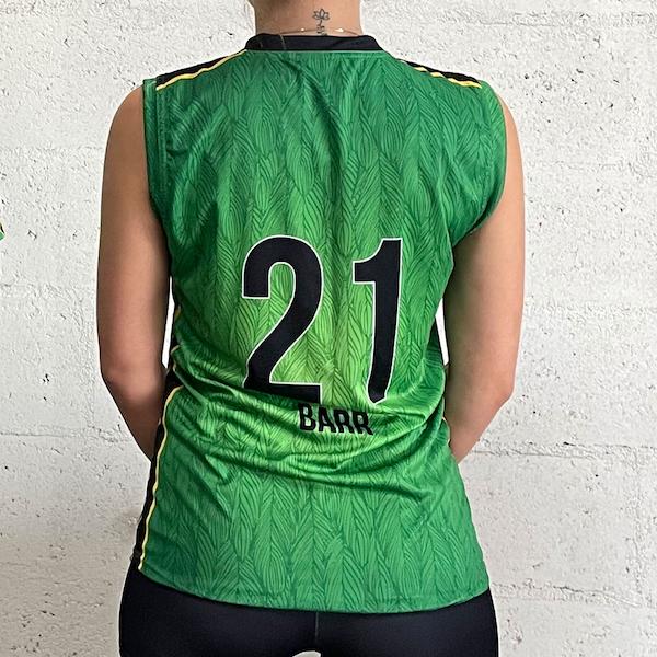 thumbnail back of a woman wearing a green sublimated sleeveless jersey #21