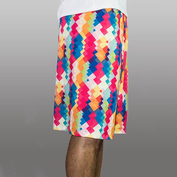 side view of man legs wearing long colorful shorts