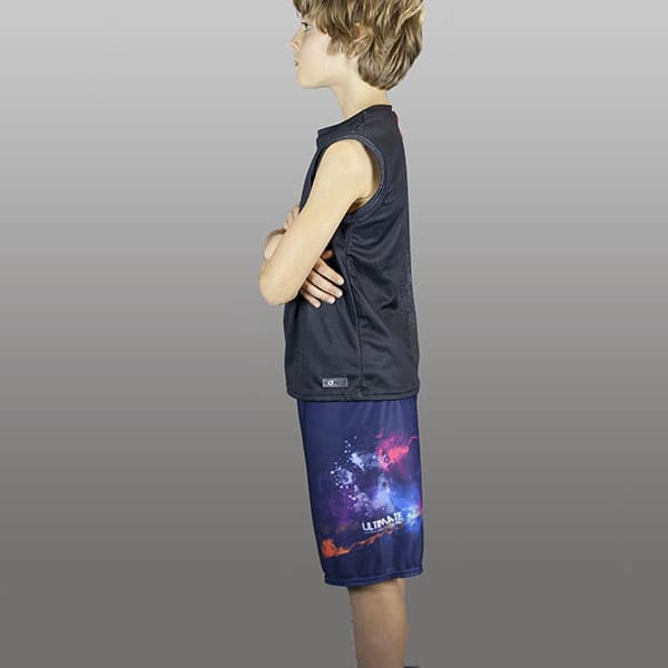 side view of kid wearing long galaxy shorts and black singlet