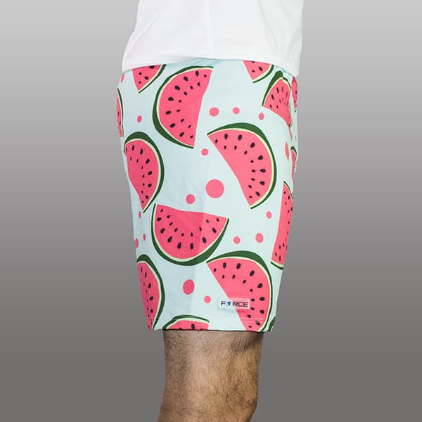 thumbnail side view of man legs wearing watermelon shorts