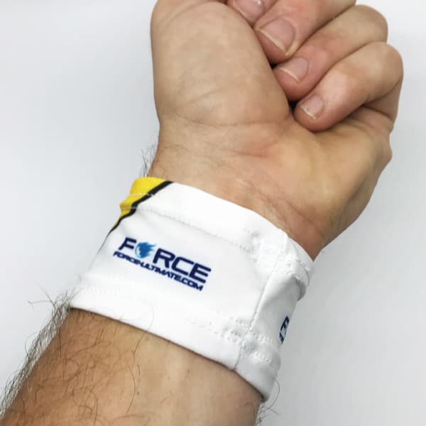 arm wearing white wristband on white background with Force writing