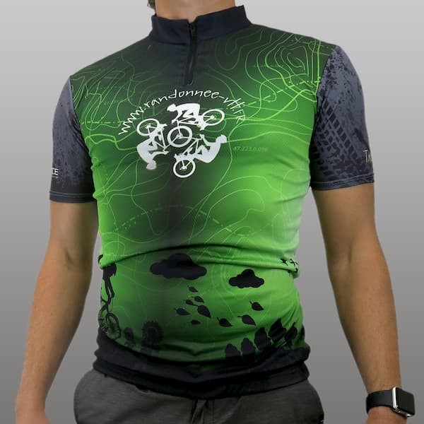 torso of man wearing a green cycling jersey
