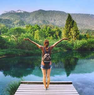 woman in front of a lake